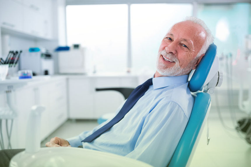 Senior Citizen Sitting For His Dental Implant Treatment In NE Calgary, AB